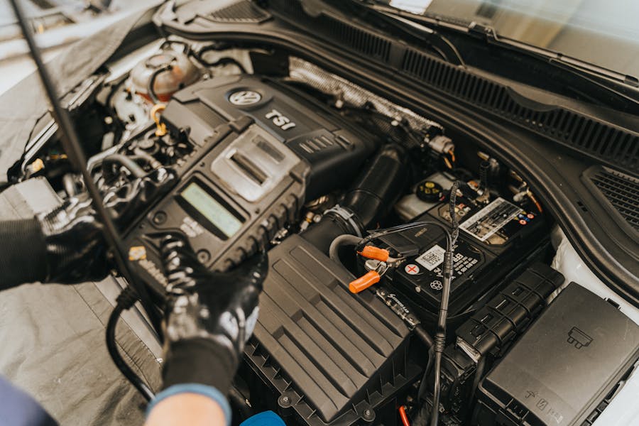 Mechanic performing electrical and battery diagnostics at Kubin Automotive