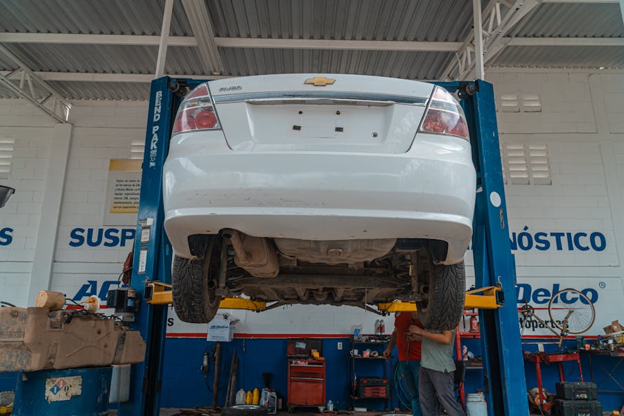 Mechanic working on suspension components at Kubin Automotive